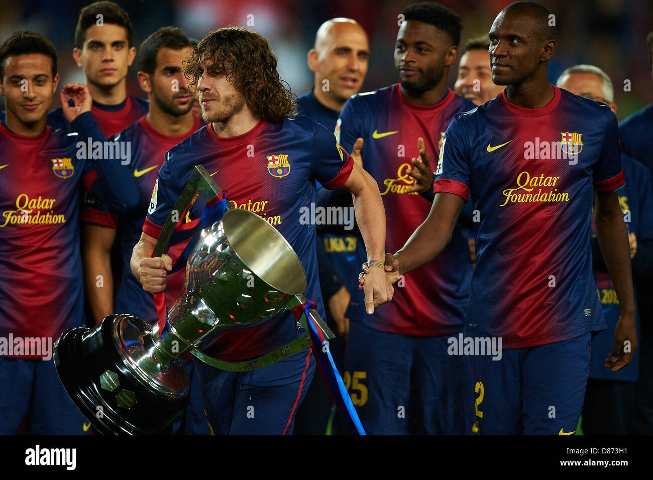 Carles Puyol (FC Barcelona) holds the La Liga Trophy with Eric Abidal (FC Barcelona), after La Liga soccer match between FC Barcelona and Real Valladolid CF, at the Camp Nou stadium in Barcelona, Spain, Sunday, May 19, 2013. Foto: S.Lau Stock Photo