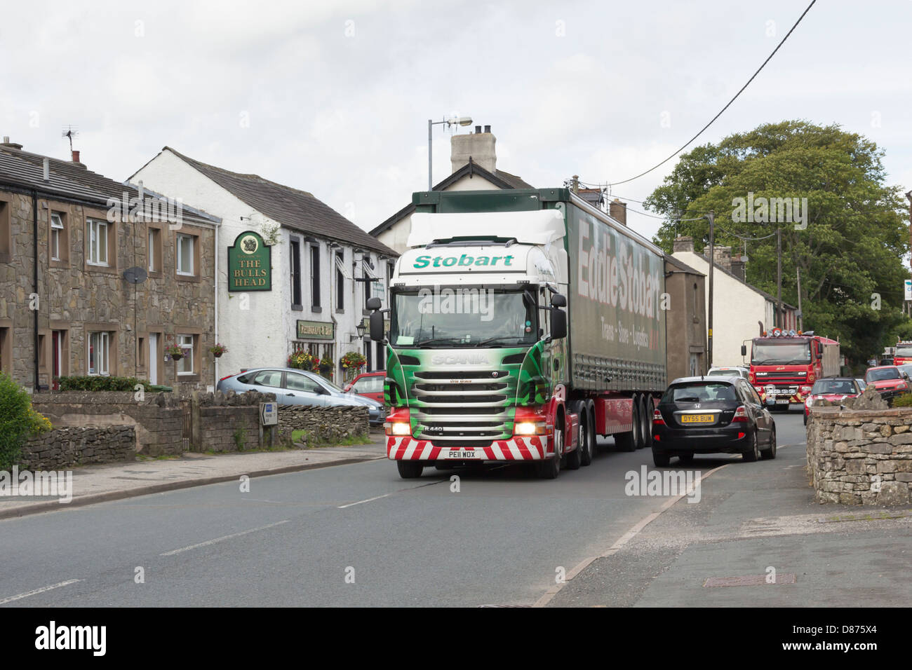 Eddie Stobart truck 5926 'Orla Grace' with a curtain-sided trailer passing through the village of Shap in Cumbria on the A6. Stock Photo
