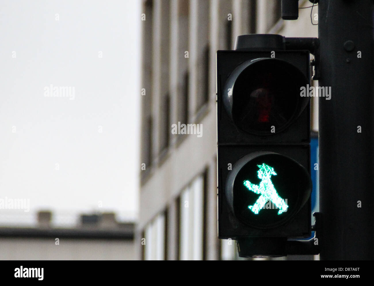 Pedestrian traffic lights in Berlin, with the traditional little green man Ampelmann, symbol of all the traffic lights in Berlin Stock Photo