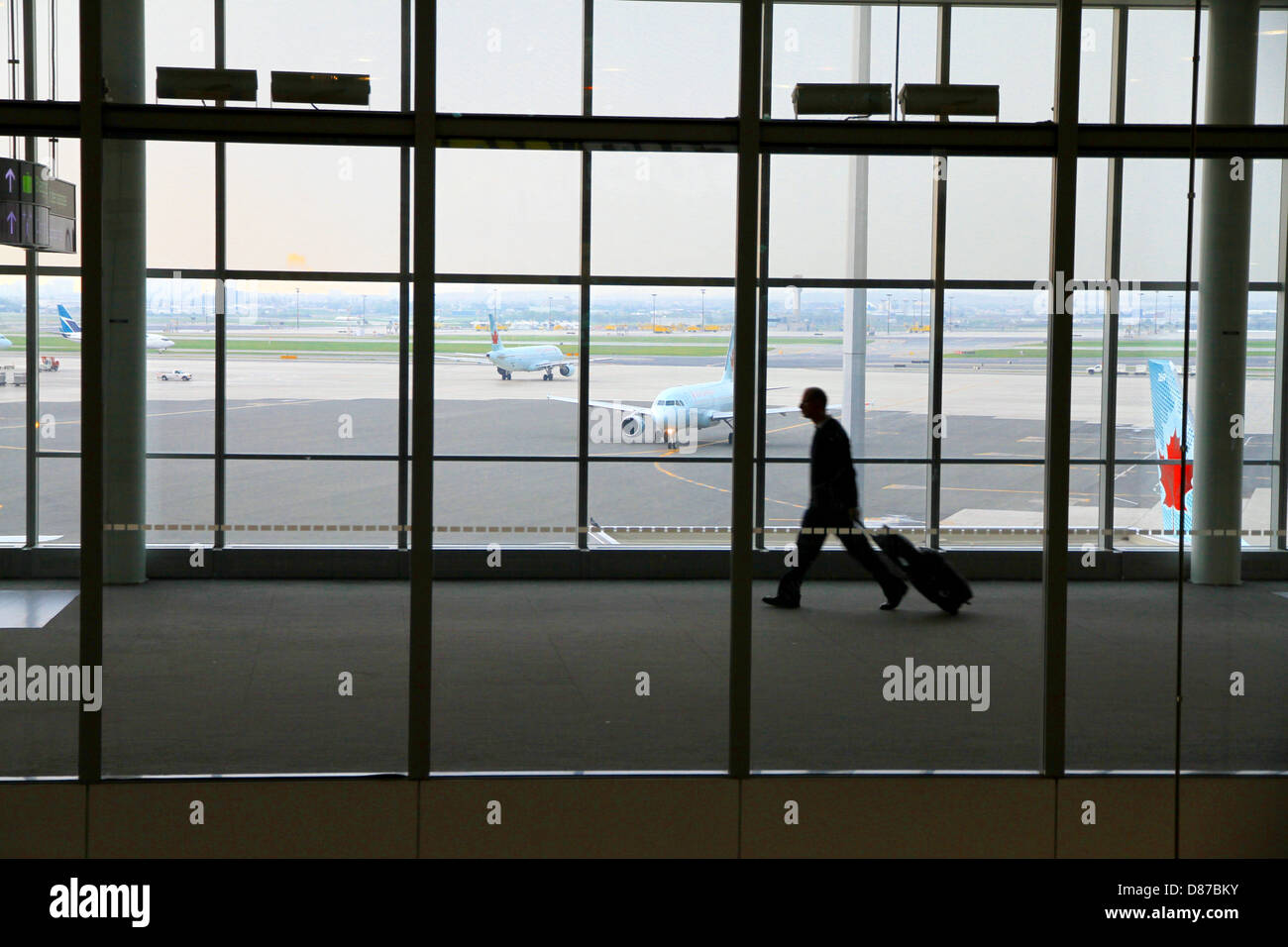 Man with carryon Stock Photo Alamy