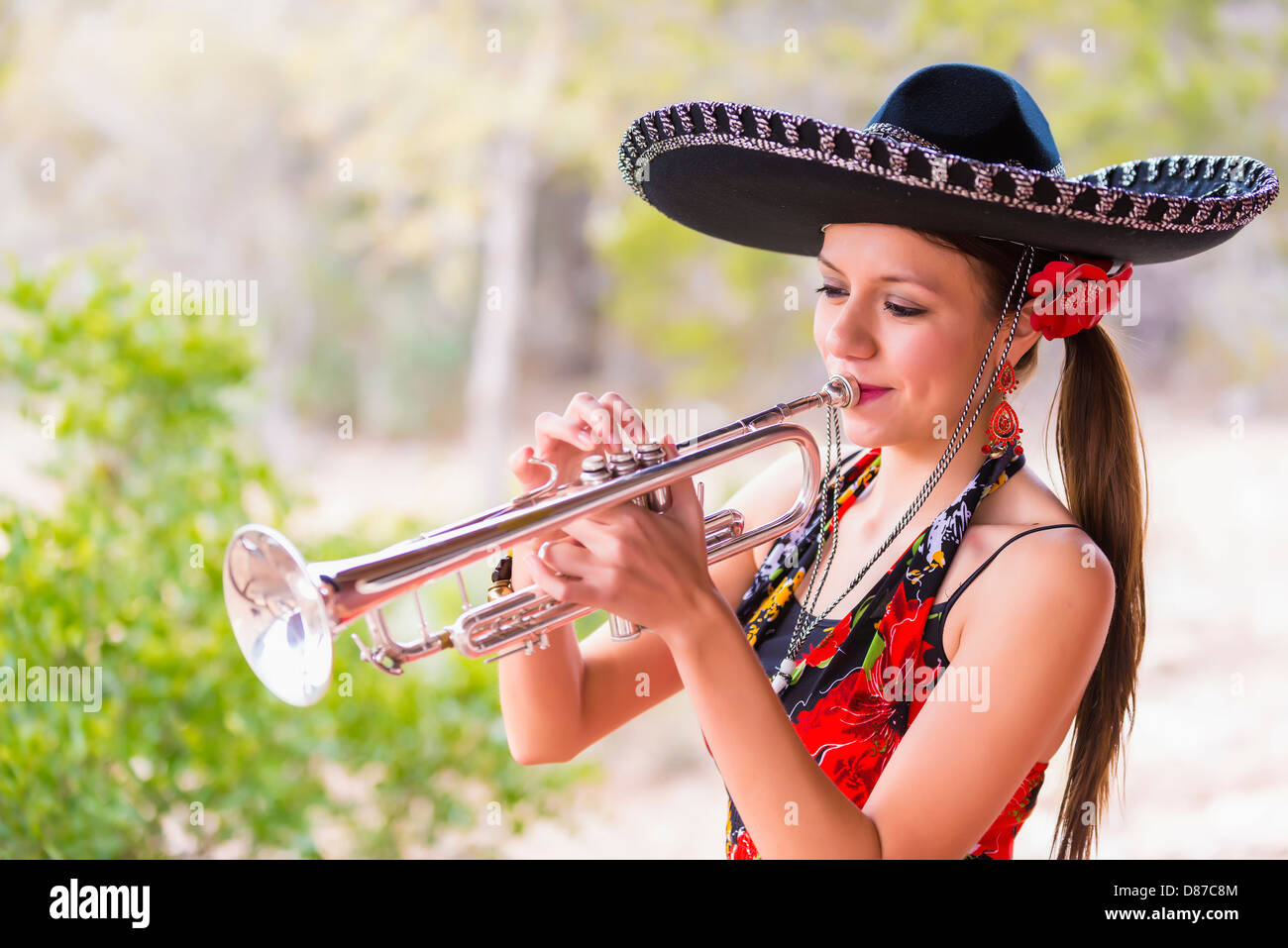 USA, Texas, Young woman playing trumpet Stock Photo Alamy