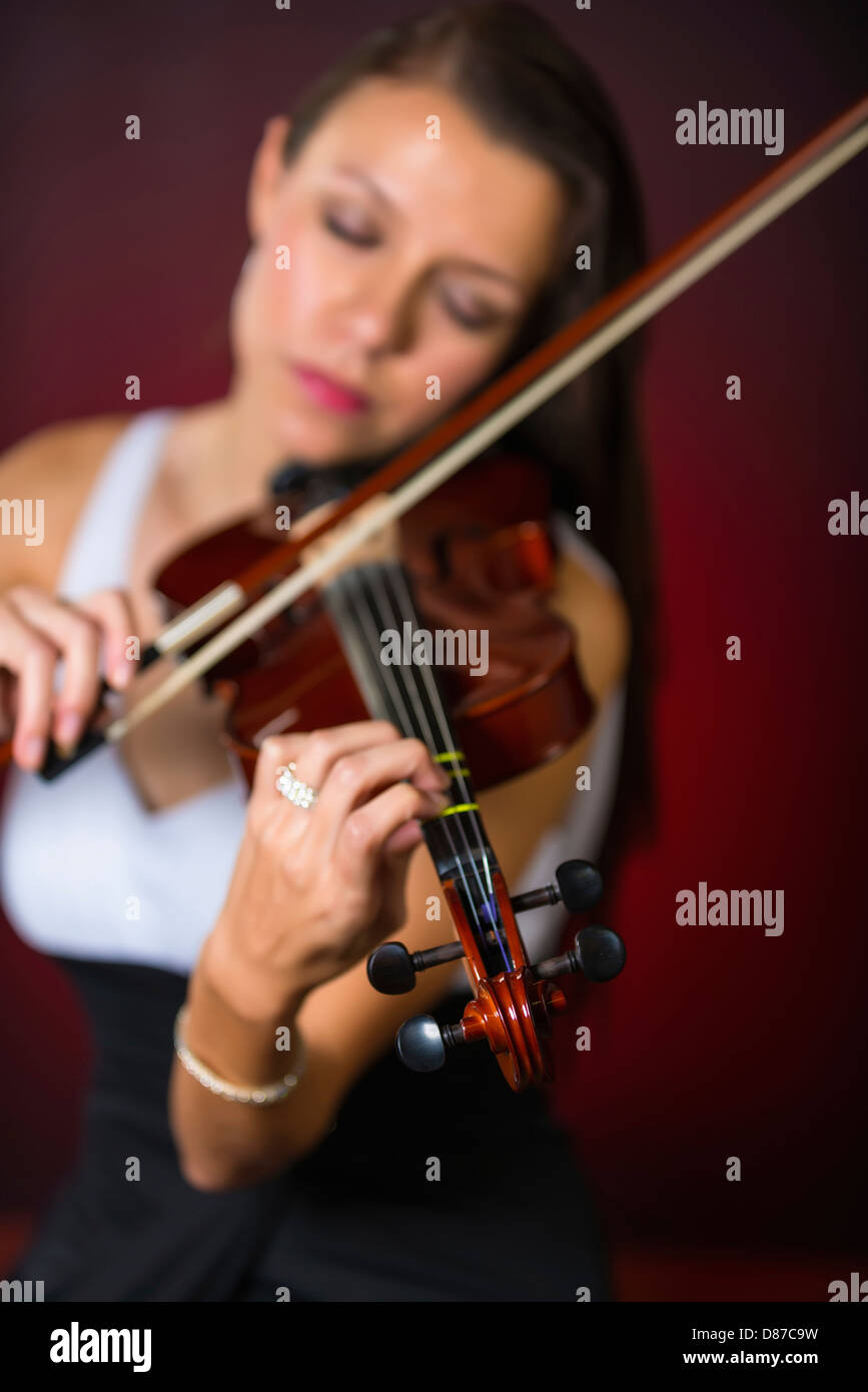 Young woman playing violin Stock Photo - Alamy