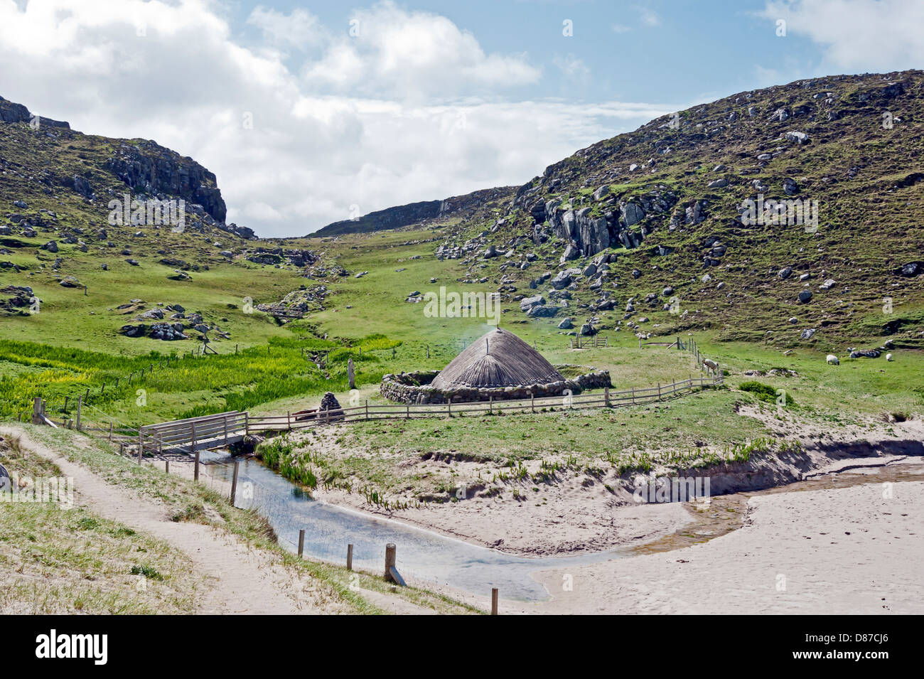 Reconstructed Iron Age House at Bostadh beach on the west coast of the Isle of Lewis in the Outer Hebrides Scotland Stock Photo