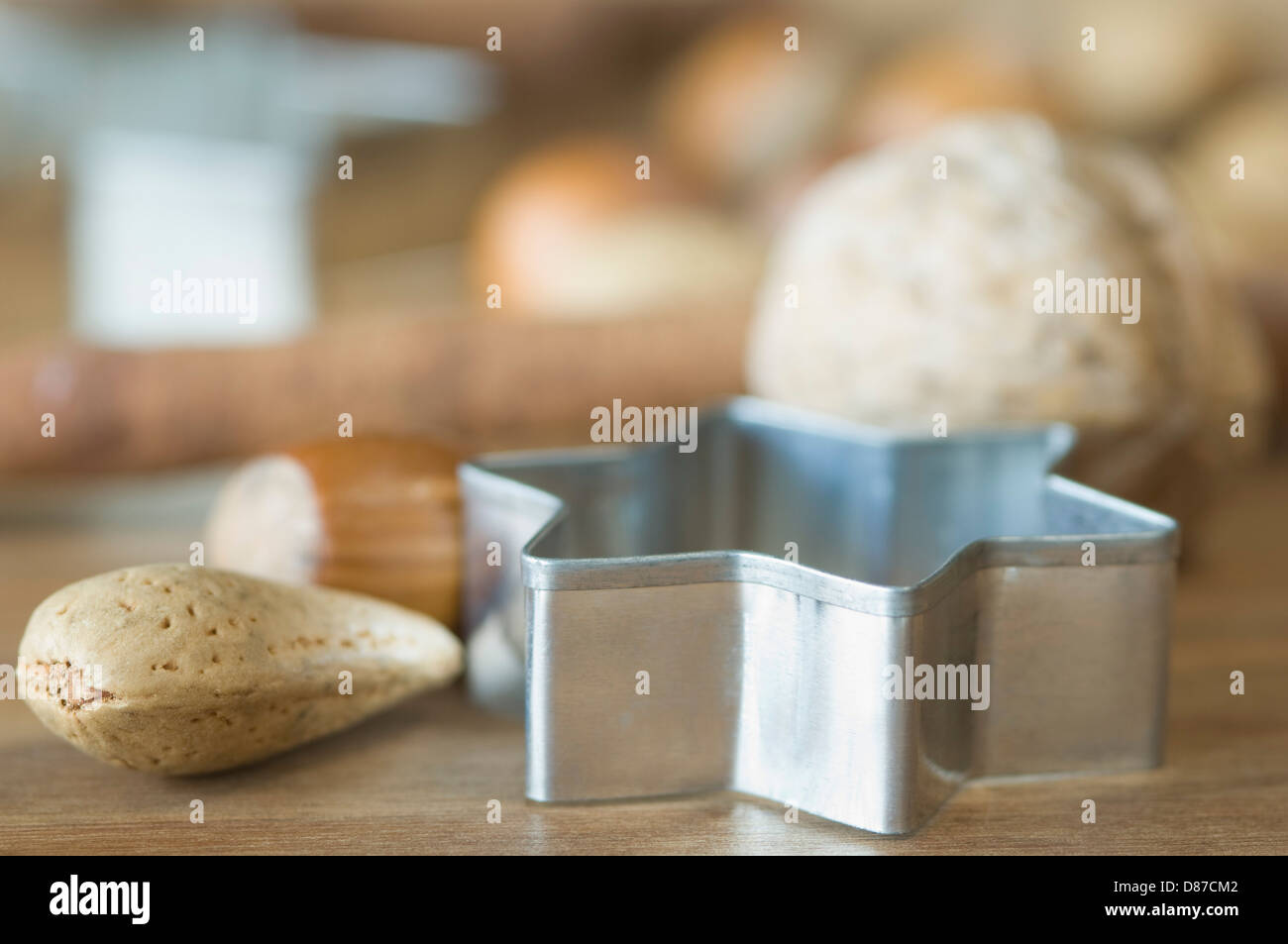 Various nuts with star shape cookie cutter for christmas on table Stock Photo