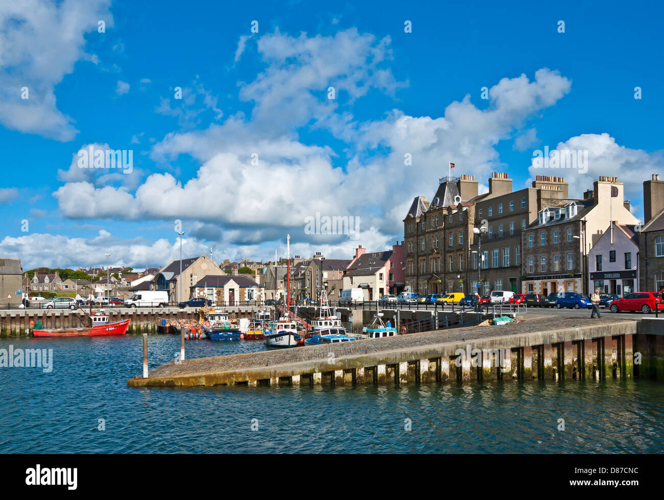 Kirkwall Harbour Orkney Scotland with fishing and pleasure boats on a sunny June day with Kirkwall Hotel behind Stock Photo