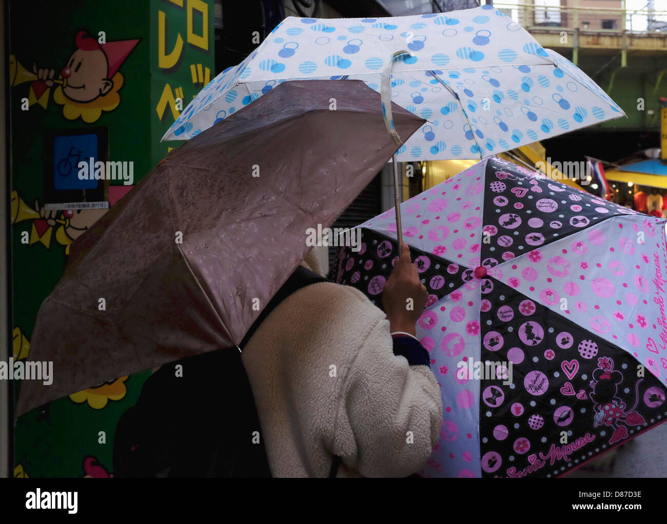People opening an umbrella in the rain Stock Photo Alamy