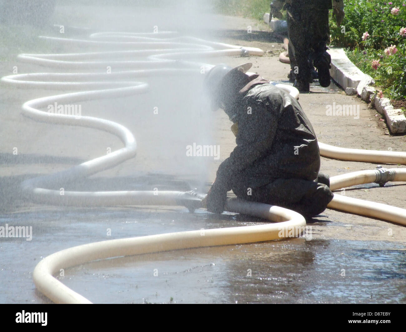 firefighters in chemical protection suit during the job Stock Photo