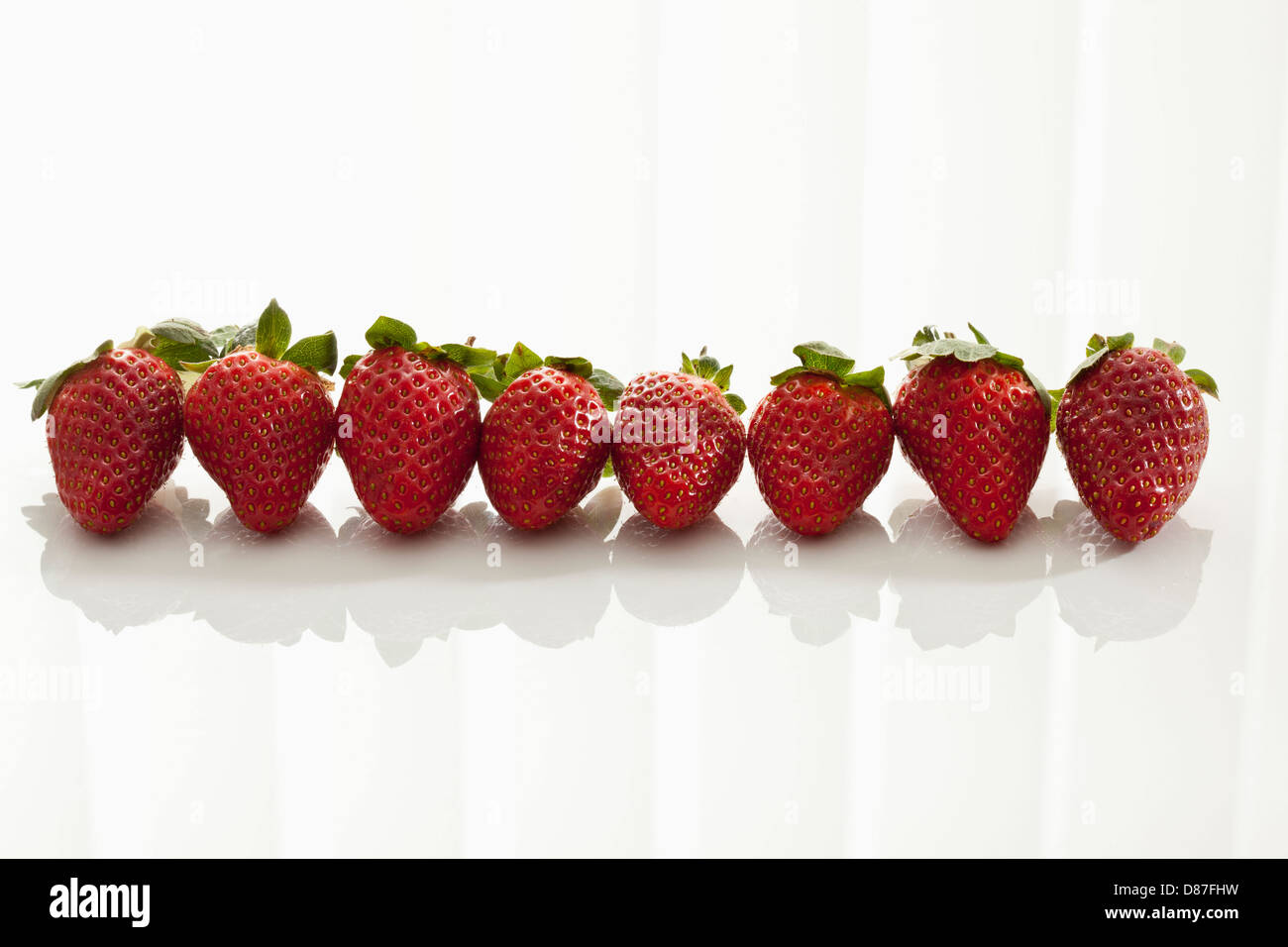 Strawberries on white background, close up Stock Photo - Alamy