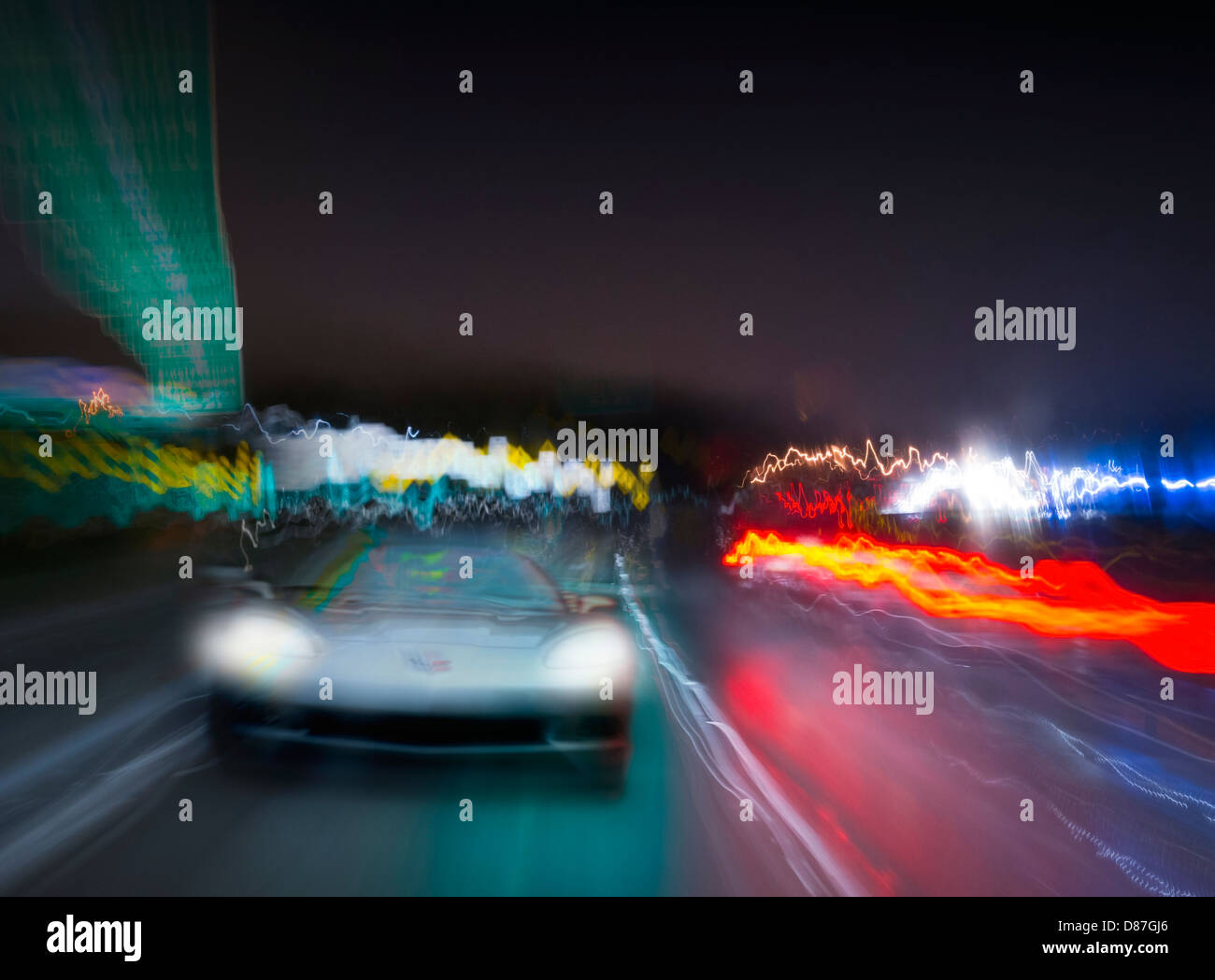 Corvette Car Speeding On Highway At Night Stock Photo