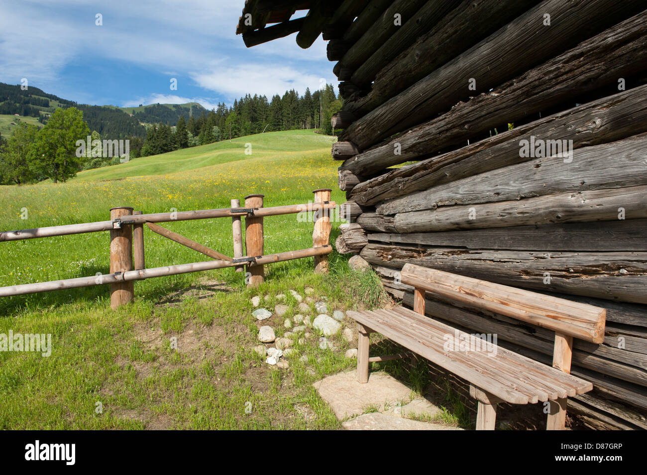 A wooden bench and hut at Lindrainweg, panoramic path at the foot of Hohe Salve, Tyrol, Austria Stock Photo