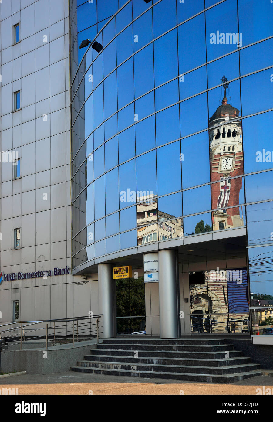 Orthodox Cathedral, St. Joan Botezatorul reflected in PETROM-building, Ploiesti, a town in the Great Wallachia, Romania Stock Photo