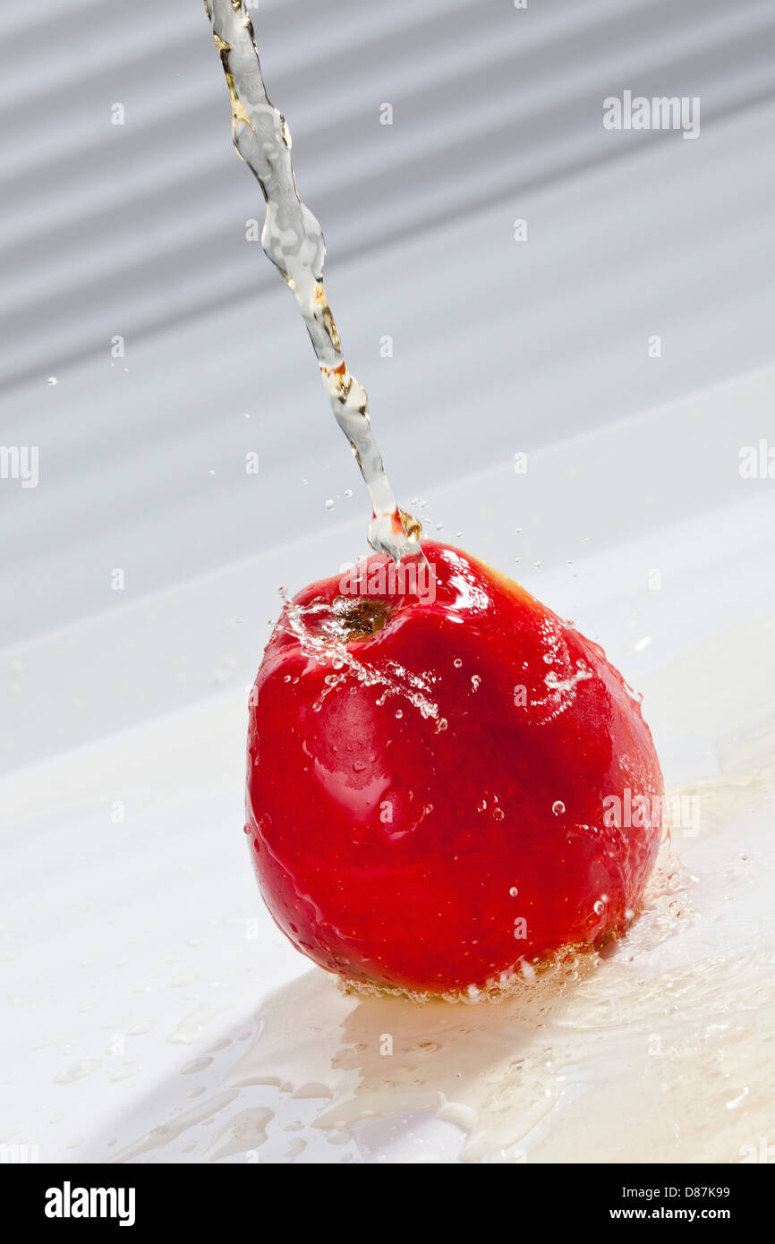 Apple juice with sparkling water pouring on apple Stock Photo Alamy