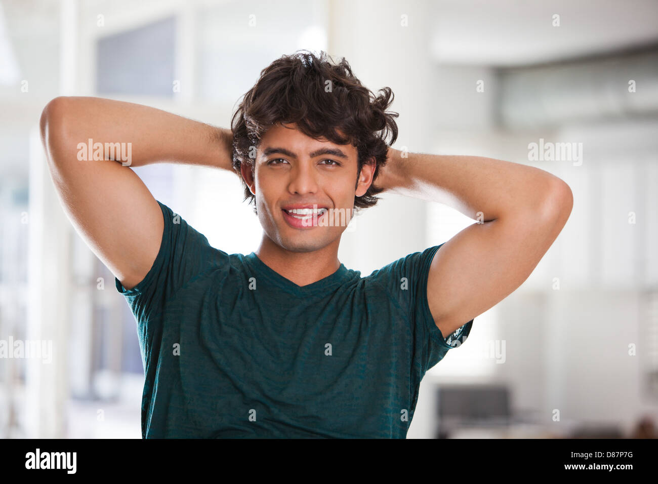 Portrait of a young man smiling looking at the camera Stock Photo - Alamy