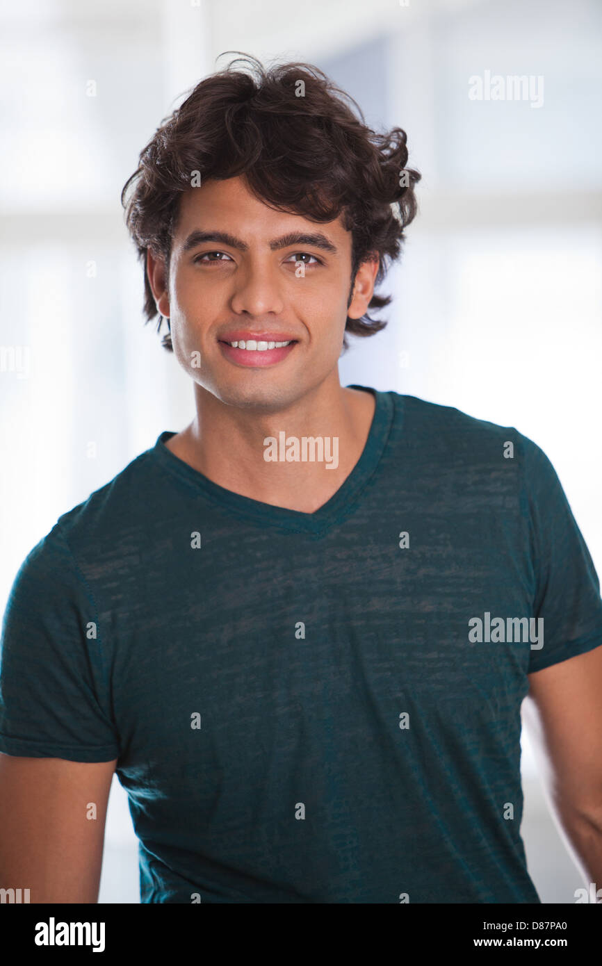 Portrait of a happy young man looking at the camera Stock Photo - Alamy