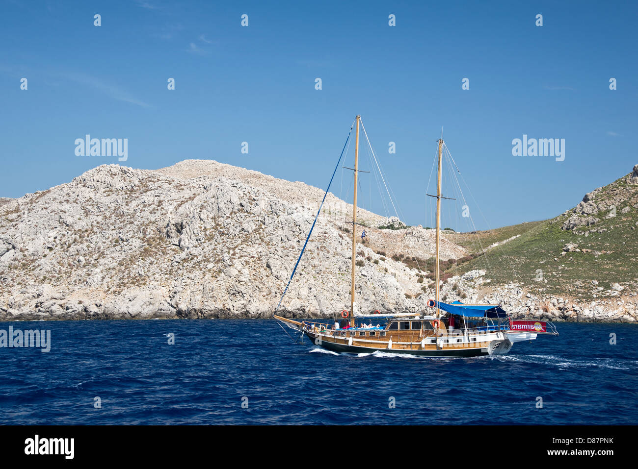 Turkish sailing boat on the Mediterranean sea, near the greek coast of the island of Symi Stock