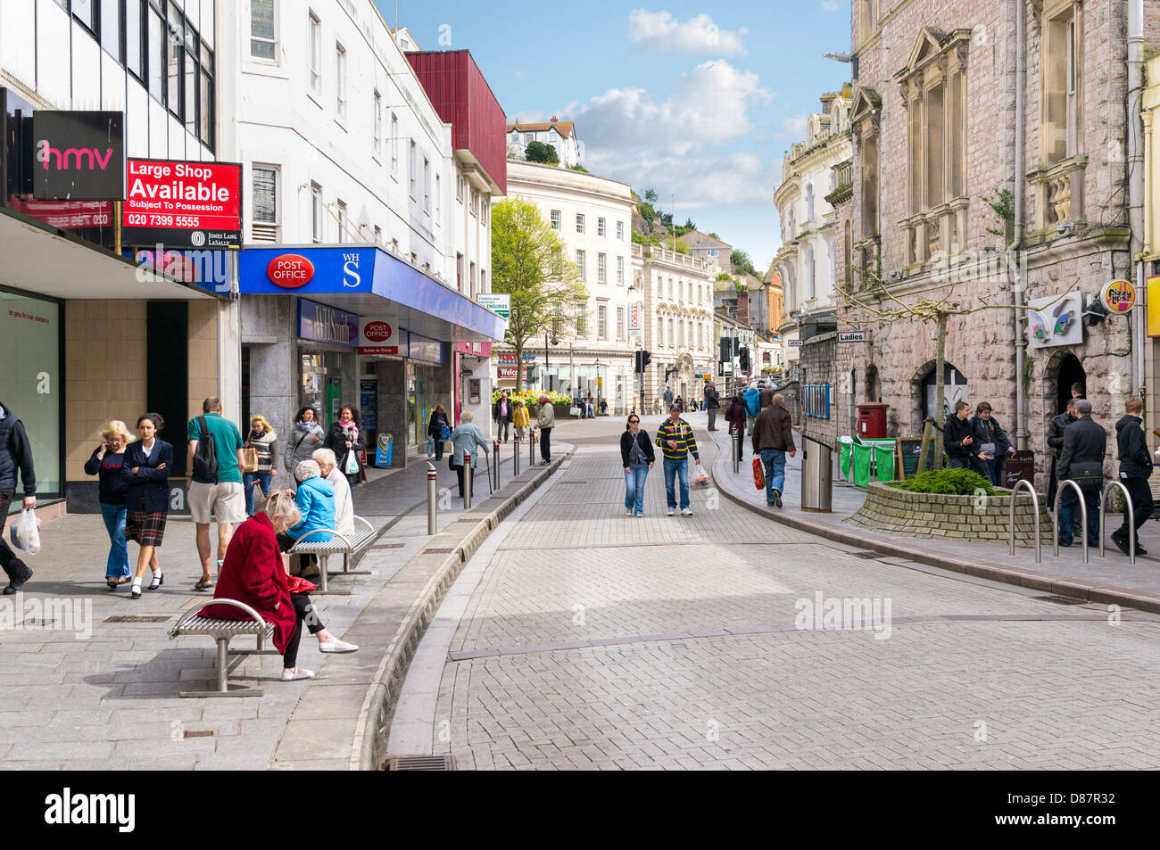 High Street shoppers shopping on a summers day in the seaside town of Torquay town centre high street, Torbay, Devon, UK Stock Photo