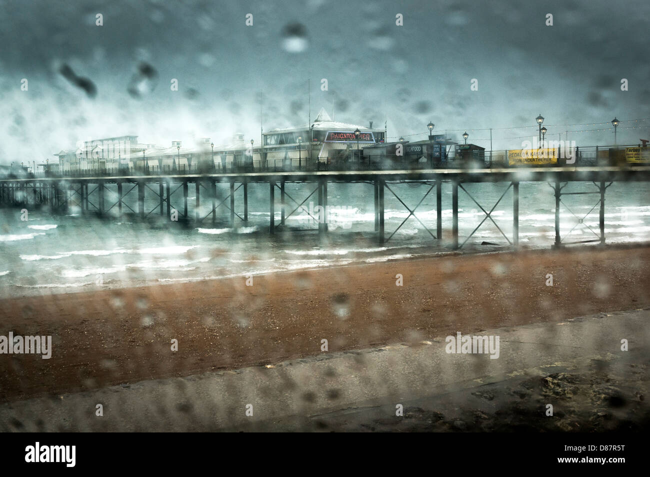 Rain at a British pier at Paignton on a rainy day in spring/summer, England, UK Stock Photo