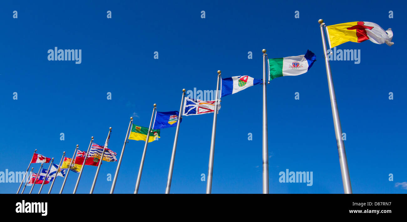 Canadian provinces and territory flags on blue sky in Ottawa Stock Photo