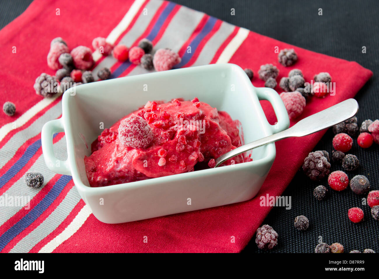Home made rasberry ice-cream with red berry mix Stock Photo - Alamy