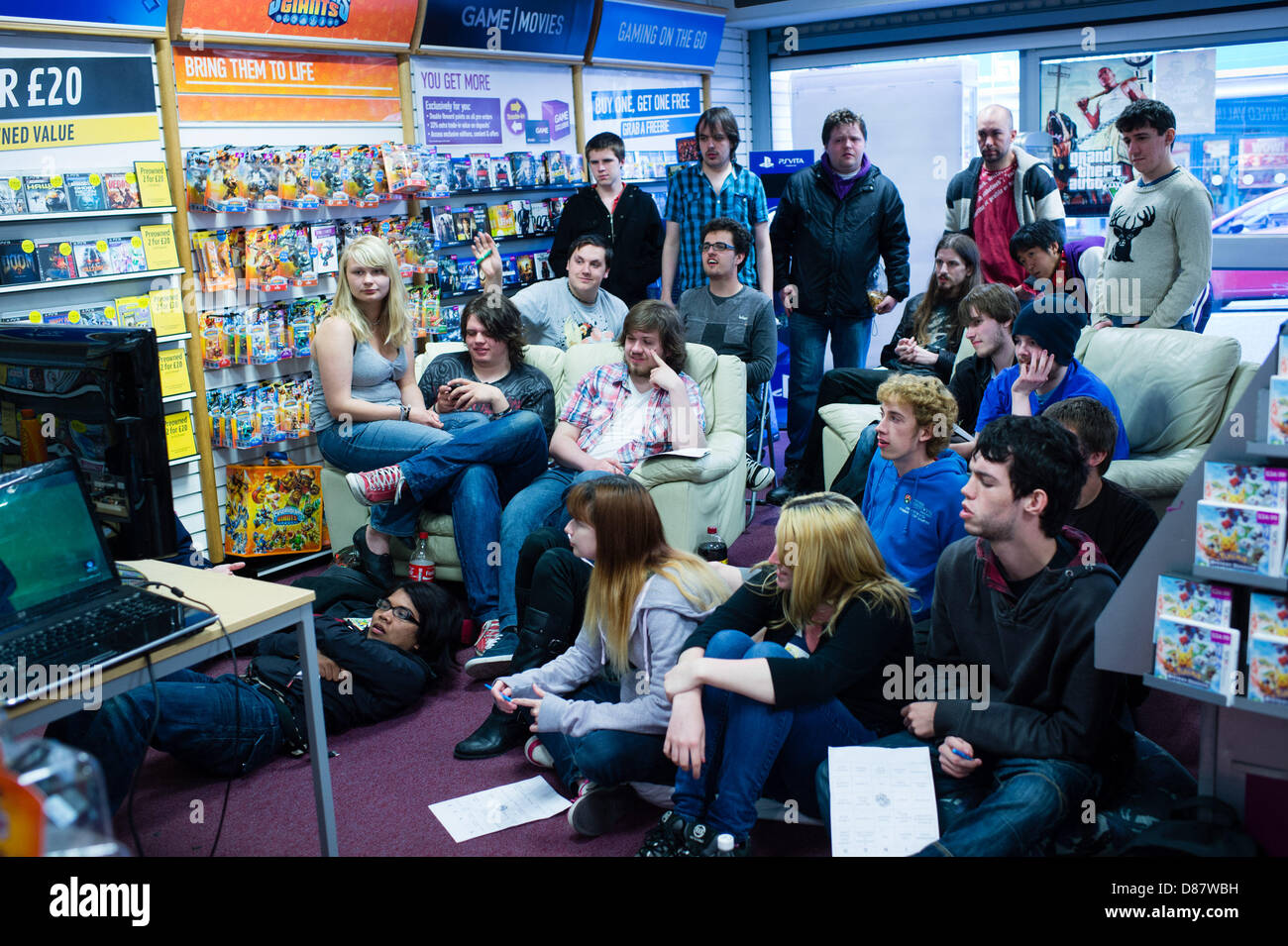 Aberystwyth, Wales, UK.  May 21 2013.   A group of avid games players at the Aberystwyth branch of Game (the high street video and computers games retailer) watching the live streaming of the announcement of the new Microsoft games console, the XBox1. The new console has 8gb of RAM and 5 billion transistors, and has full body tracking, including wrist and shoulders.  photo Credit:  Keith Morris/Alamy Live News Stock Photo