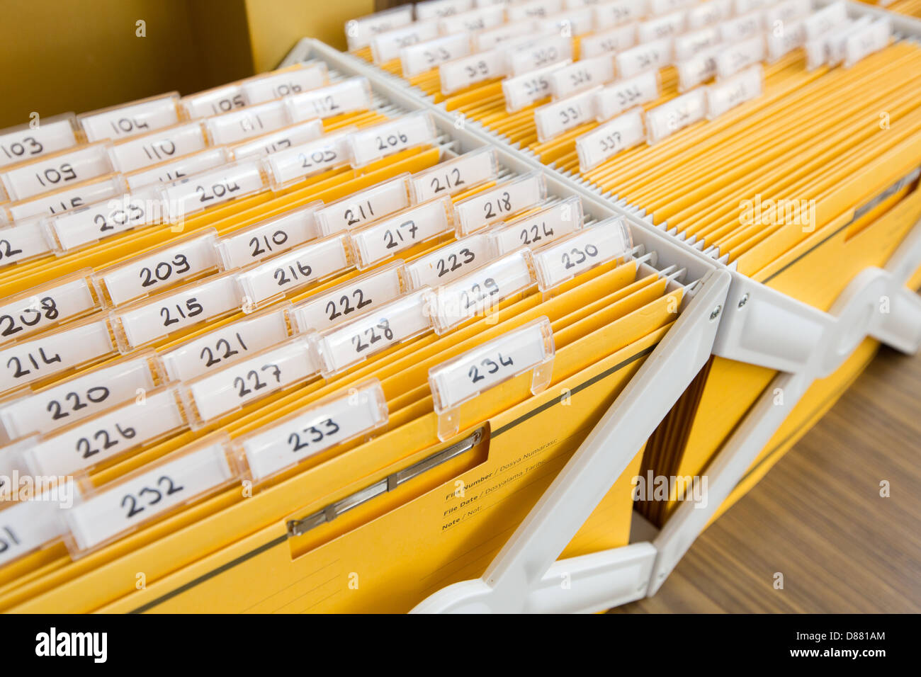 Yellow file cabinet on a hotel reception Stock Photo