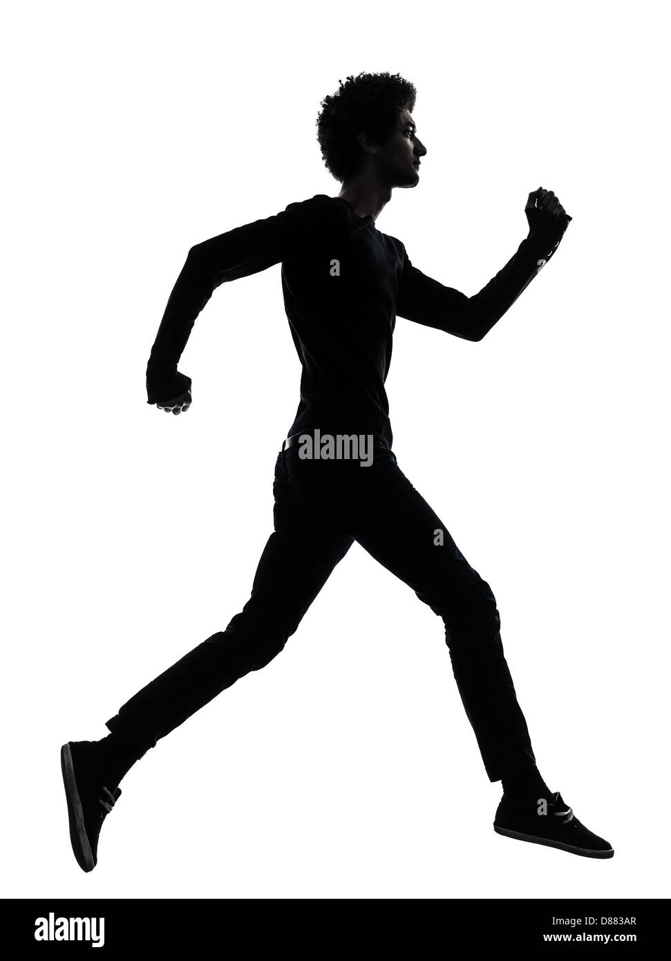 one african handsome young man running in silhouette studio isolated on white background Stock Photo