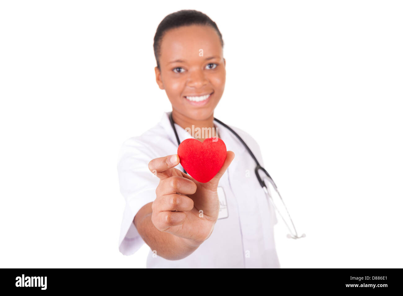Young nurse with heart in her hand isolated Stock Photo