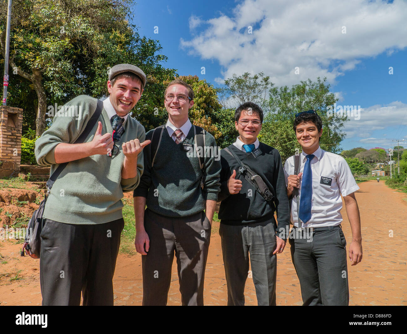 A group of four Mormon young adult male missionaries on their two-year missionary service proselytizing in Luque, Paraguay. Stock Photo