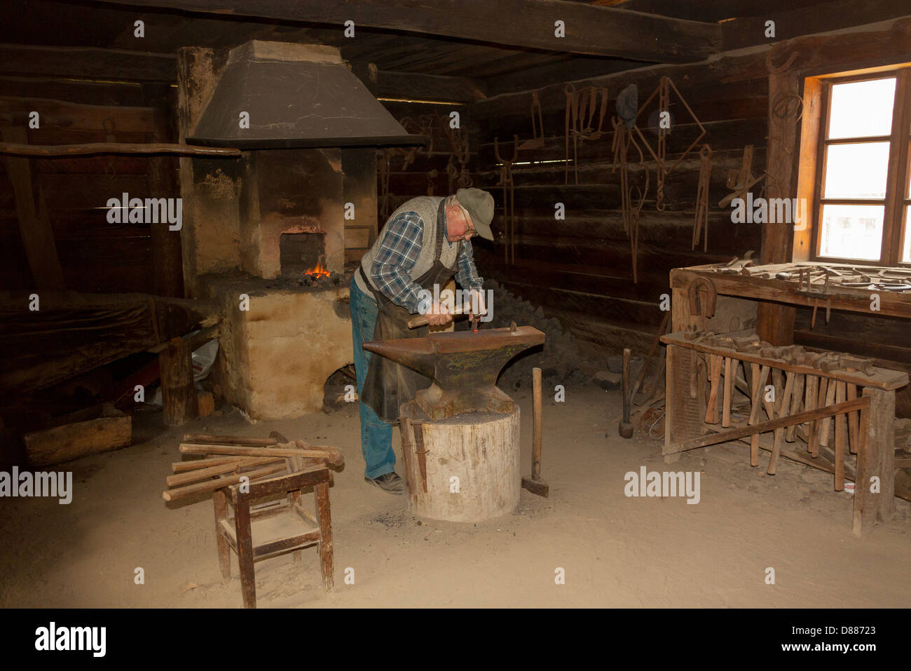 Blacksmith at work in smithy that comes from Żuromin town, now located in  Museum of the Mazovian Countryside in Sierpc, Poland Stock Photo - Alamy
