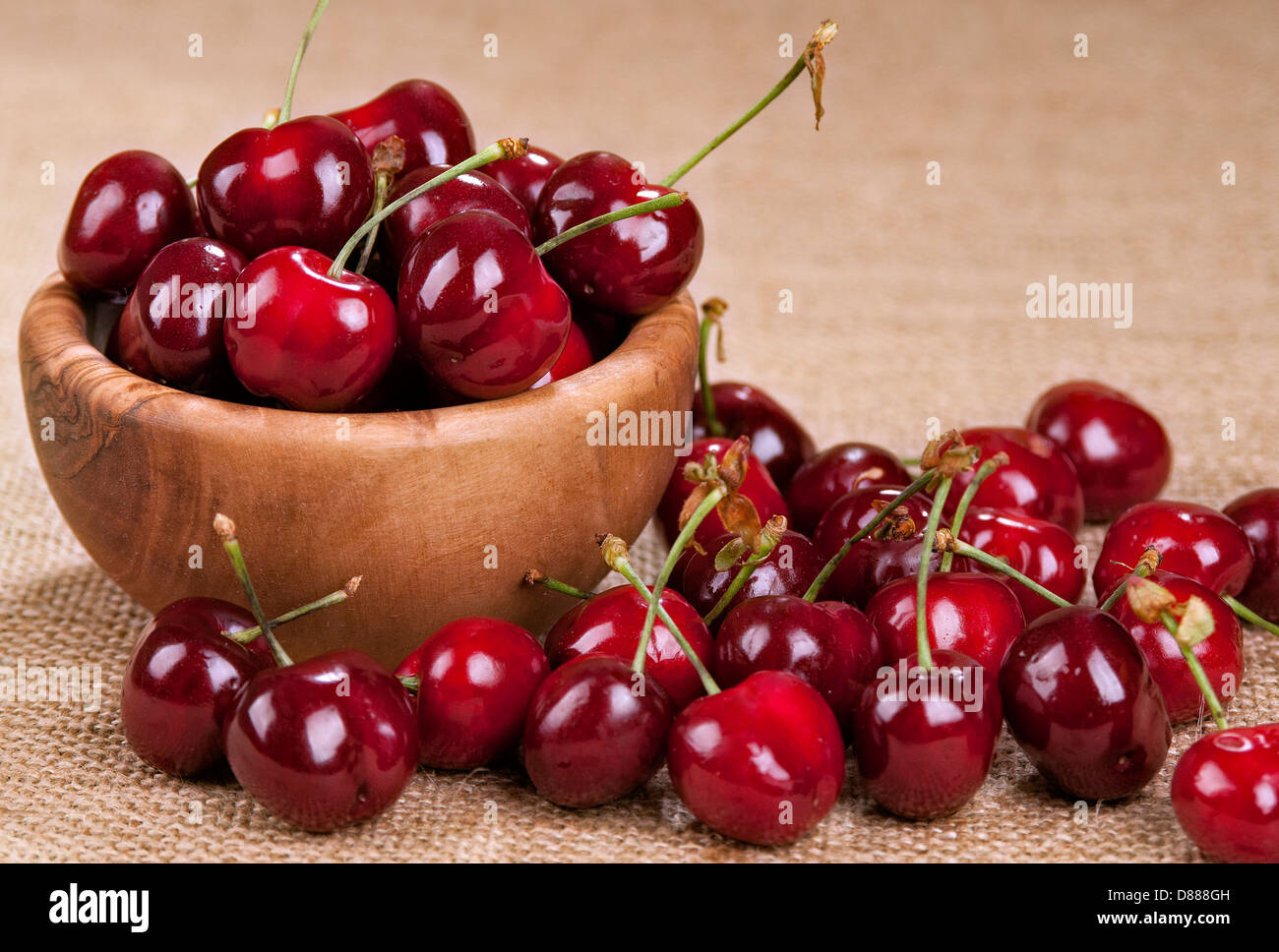 Sour cherries in a wooden bowl Stock Photo