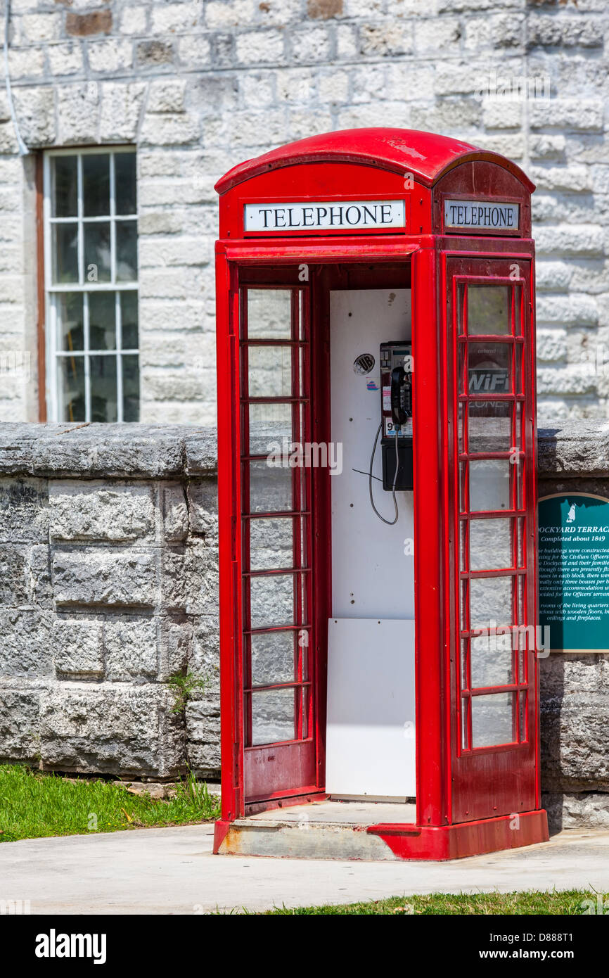 A red telephone box, typical of the English influence, in the Royal Naval Dockyard, Bermuda. Stock Photo