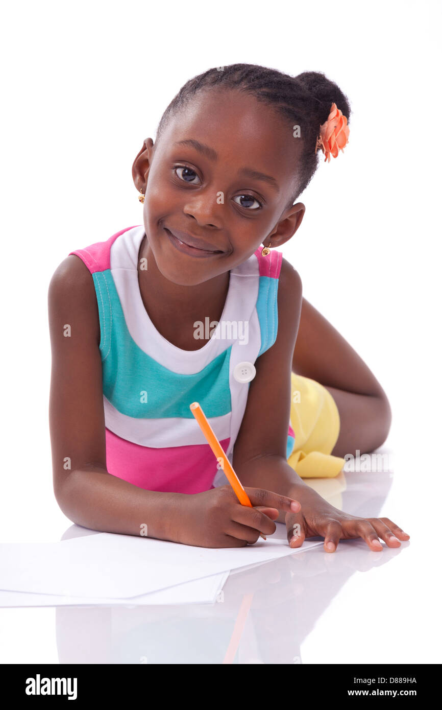 Cute black african american little girl drawing, isolated on white background - African people - Children Stock Photo