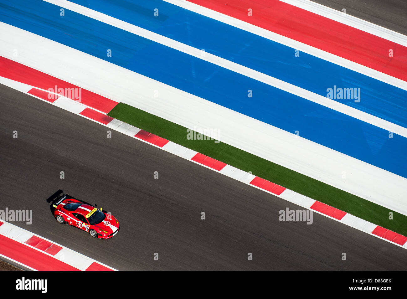 A Ferrari 458 races at Circuit of the Americas, Austin, Texas during Grand-Am racing weekend, March 2nd, 2013. Stock Photo