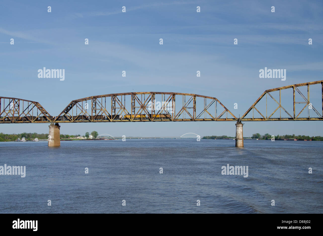Kentucky / Ohio, Ohio River near the Mississippi River junction. Freight train traveling on bridge over the Ohio River. Stock Photo