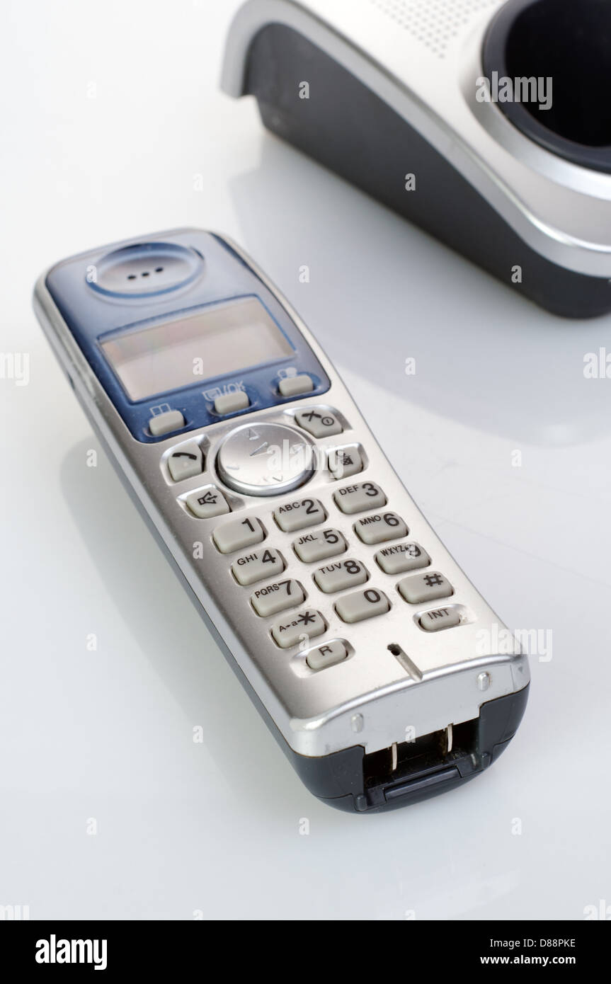 Wireless silver telephone with - cradle closeup shot Stock Photo