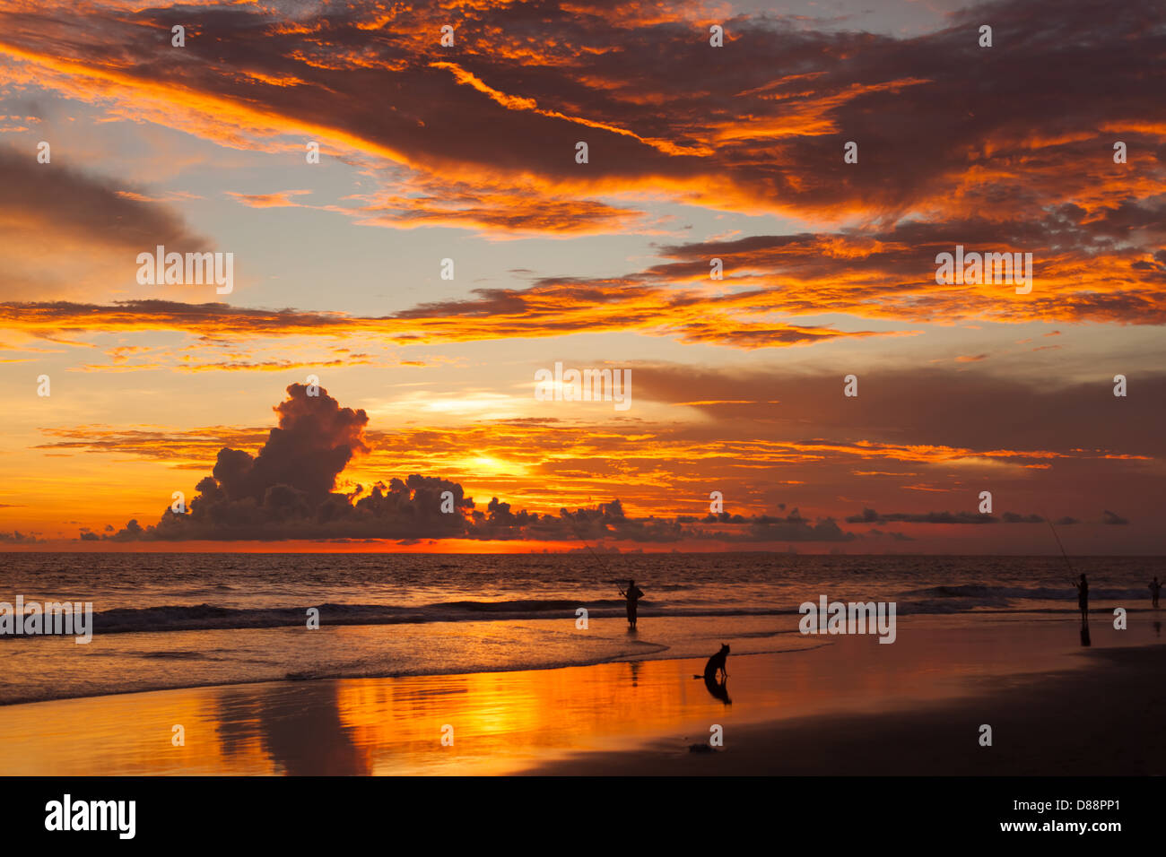 Sunset on beach in Bali in Indonesia Stock Photo - Alamy
