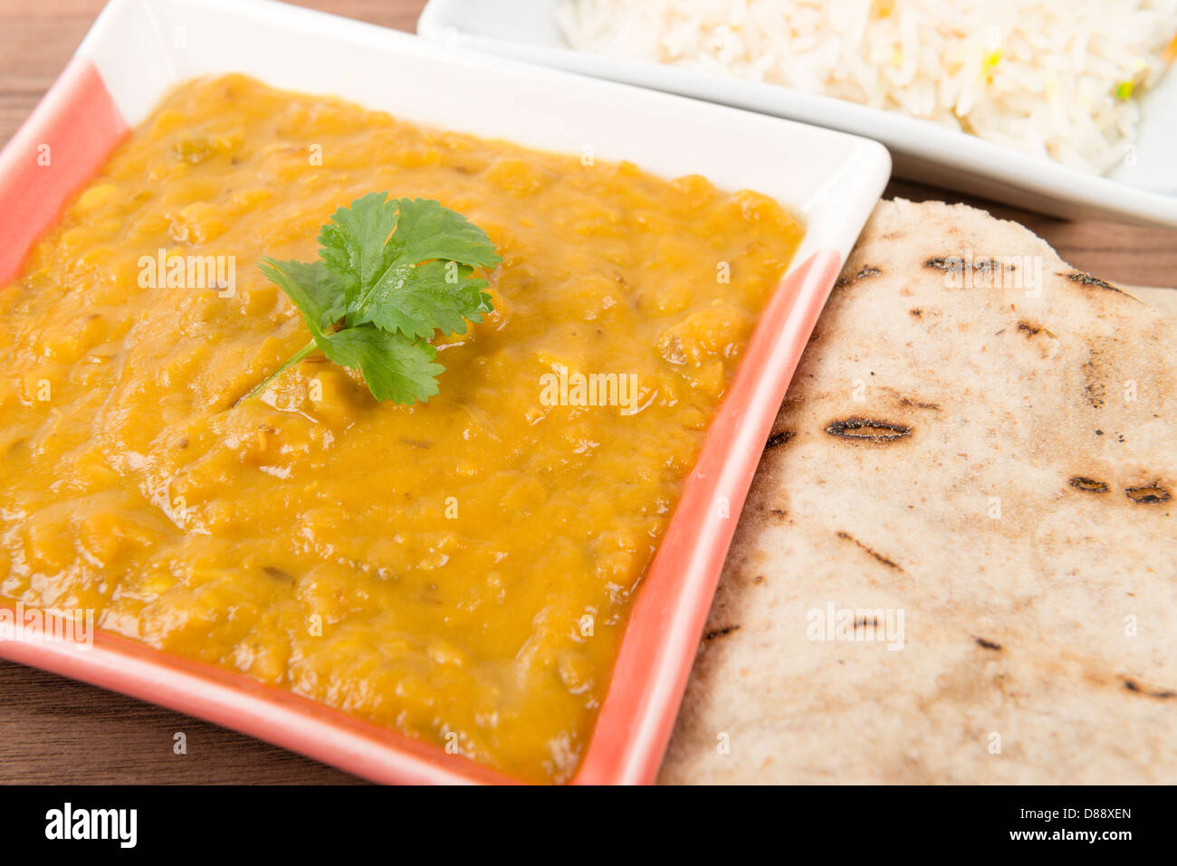 Tarka Dal Indian yellow split pea curry garnished with coriander and