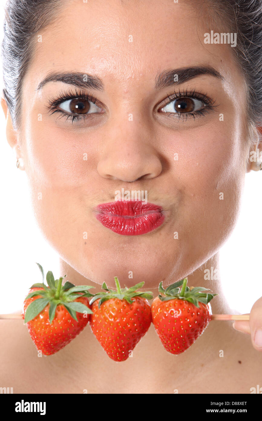 Woman eating summer strawberries hi-res stock photography and images ...