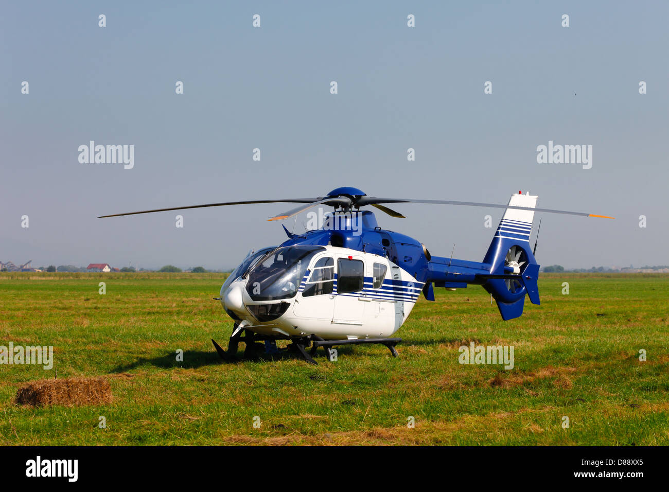 Helicopter on green field Stock Photo