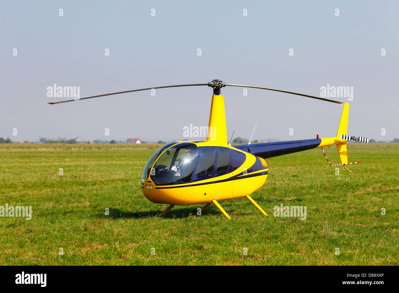 Helicopter on green field Stock Photo