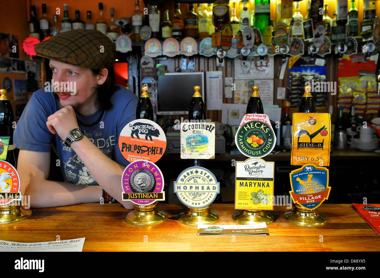 Landlord Behind the bar of The White Lion pub, Norwich, Norfolk Stock