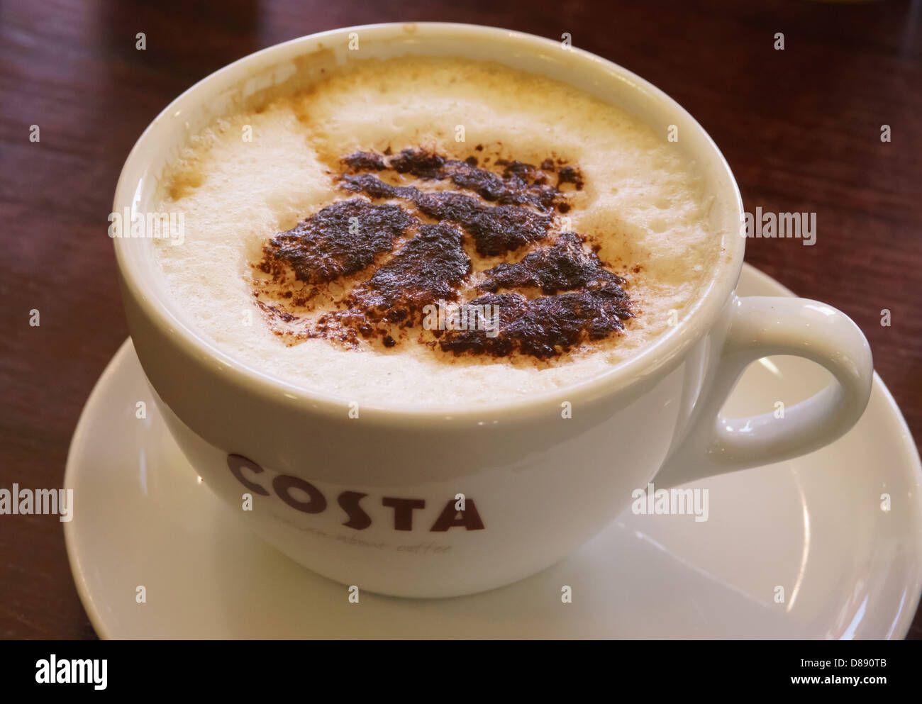 Medium Costa cappucino coffee with chocolate dusting (UK café chain) Stock Photo