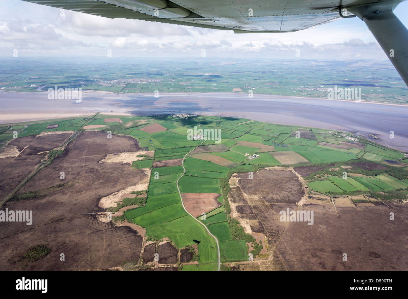 River Eden flowing towards the Solway Firth with Scotland in the distance, from a light aircraft flight fro0m Carlisle Airport. Stock Photo