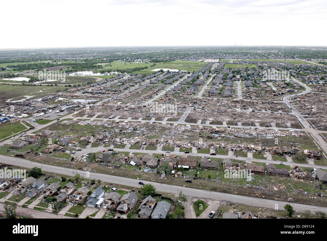 Aerial view of destruction from an EF-5 tornado May 21, 2013 in Moore, Oklahoma. The massive storm with winds exceeding 200 miles per hour tore through the Oklahoma City suburb May 20, 2013, killing at least 24 people, injuring more than 230 and displacing thousands. Stock Photo