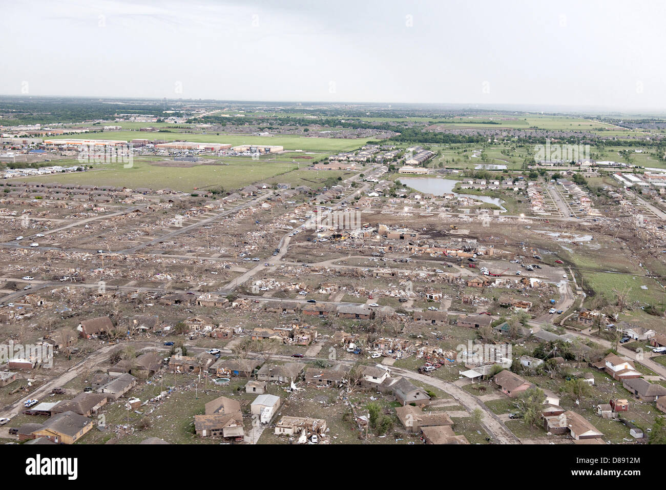 Aerial view of destruction from an EF-5 tornado May 21, 2013 in Moore, Oklahoma. The massive storm with winds exceeding 200 miles per hour tore through the Oklahoma City suburb May 20, 2013, killing at least 24 people, injuring more than 230 and displacing thousands. Stock Photo