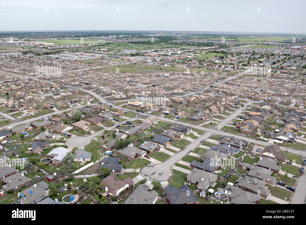 Aerial view of destruction from an EF-5 tornado May 21, 2013 in Moore, Oklahoma. The massive storm with winds exceeding 200 miles per hour tore through the Oklahoma City suburb May 20, 2013, killing at least 24 people, injuring more than 230 and displacing thousands. Stock Photo