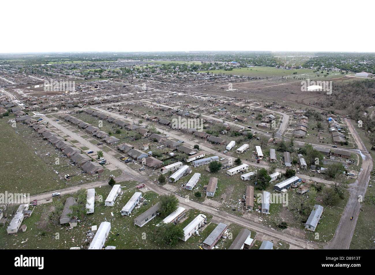 Aerial view of destruction from an EF-5 tornado May 21, 2013 in Moore, Oklahoma. The massive storm with winds exceeding 200 miles per hour tore through the Oklahoma City suburb May 20, 2013, killing at least 24 people, injuring more than 230 and displacing thousands. Stock Photo