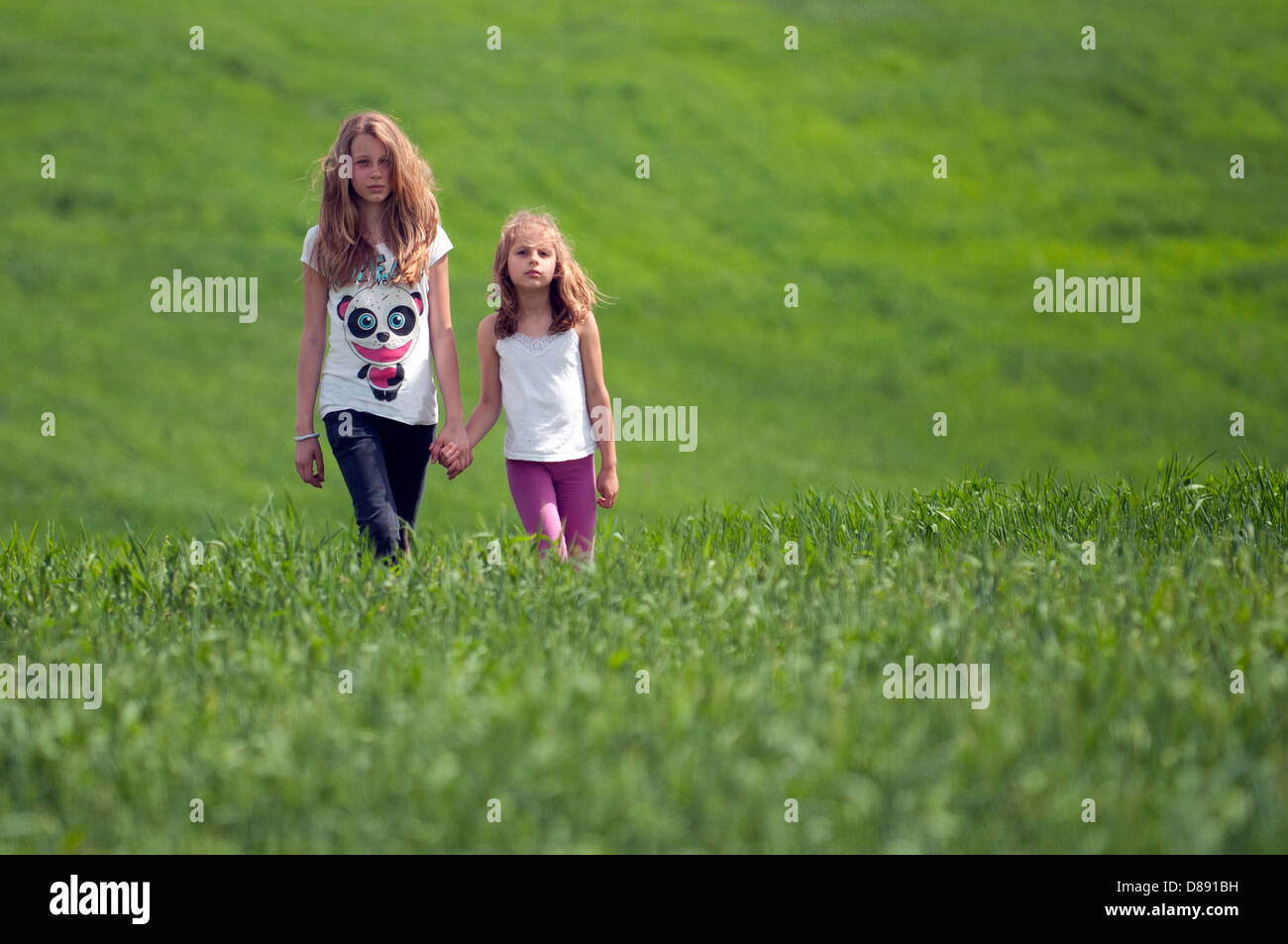 Two girls walking hi-res stock photography and images - Alamy