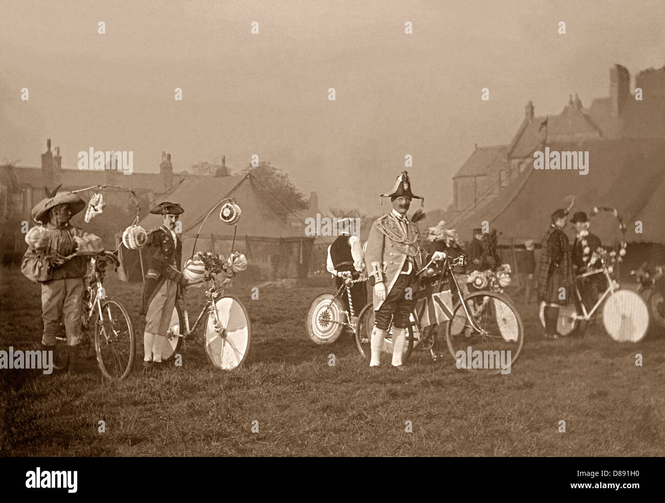 Men and their bicycles - both in fancy dress, England, c.1900 Stock Photo