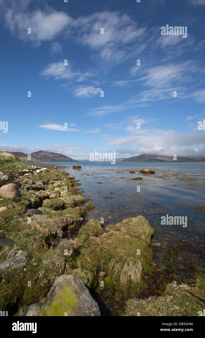 Loch Fleet, Scotland. Loch Fleet with a cloud covered Balblair Wood, Mound Rock and Princess Cairn in the background. Stock Photo
